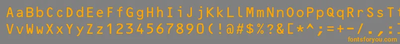 フォントOcrBcyr – オレンジの文字は灰色の背景にあります。