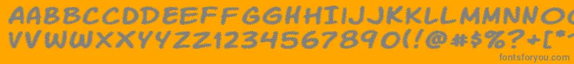 Komikatr-Schriftart – Graue Schriften auf orangefarbenem Hintergrund