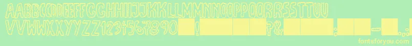 JmhEscamasOut Font – Yellow Fonts on Green Background