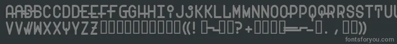 Transam-fontti – harmaat kirjasimet mustalla taustalla