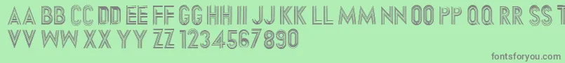 Dirtyhatchcaps Font – Gray Fonts on Green Background