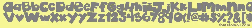 AkadylanPlain-Schriftart – Graue Schriften auf gelbem Hintergrund