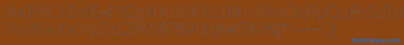 ReganslabUltralight Font – Blue Fonts on Brown Background