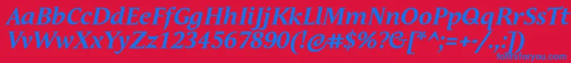 Czcionka AndulkaTextProBoldItalic – niebieskie czcionki na czerwonym tle