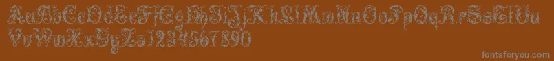 LeafyGlade-fontti – harmaat kirjasimet ruskealla taustalla