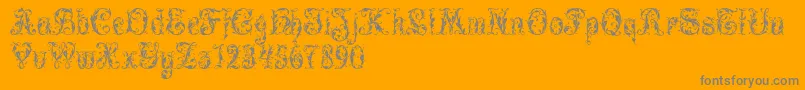 LeafyGlade-Schriftart – Graue Schriften auf orangefarbenem Hintergrund