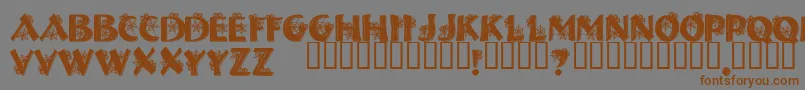 フォントHalls ffy – 茶色の文字が灰色の背景にあります。