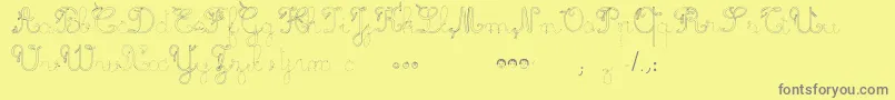 MaternellecolorTraceCursive3 Font – Gray Fonts on Yellow Background