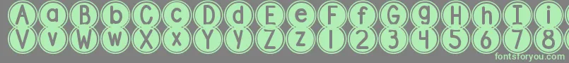 DjbPokeyDots-Schriftart – Grüne Schriften auf grauem Hintergrund