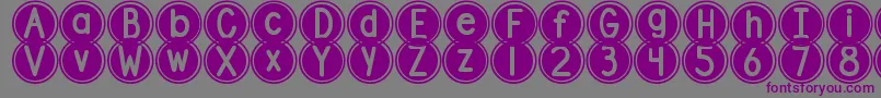 DjbPokeyDots-fontti – violetit fontit harmaalla taustalla