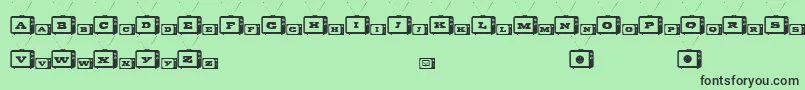 TinyTube-Schriftart – Schwarze Schriften auf grünem Hintergrund