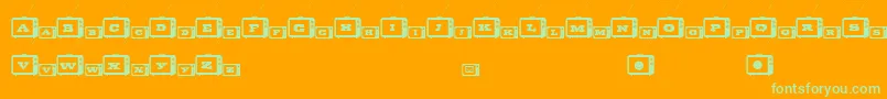 TinyTube Font – Green Fonts on Orange Background