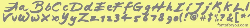 JapaneseBrush-Schriftart – Graue Schriften auf gelbem Hintergrund