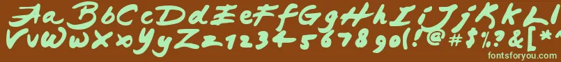 フォントJapaneseBrush – 緑色の文字が茶色の背景にあります。