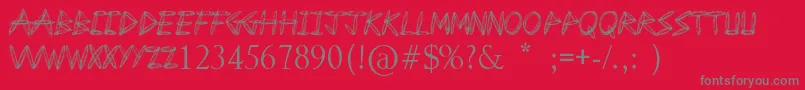 DrawFreehand-fontti – harmaat kirjasimet punaisella taustalla