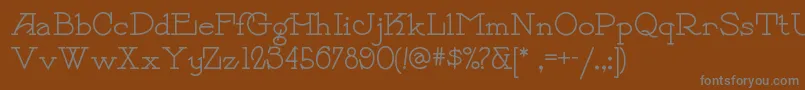 Payzantpennf-fontti – harmaat kirjasimet ruskealla taustalla