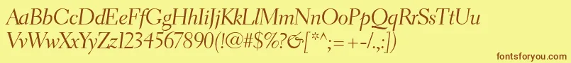 フォントElectraltstdCursivedisplay – 茶色の文字が黄色の背景にあります。