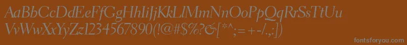 ElectraltstdCursivedisplay-fontti – harmaat kirjasimet ruskealla taustalla