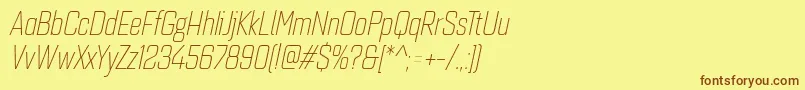 フォントQuarcacondlightitalic – 茶色の文字が黄色の背景にあります。