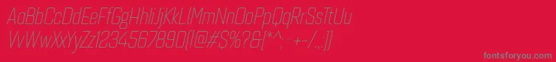 フォントQuarcacondlightitalic – 赤い背景に灰色の文字