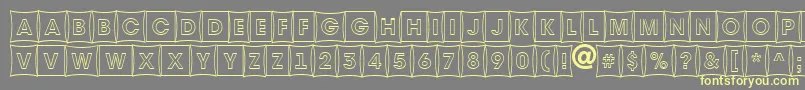 AAvantetitulcmfshotl-fontti – keltaiset fontit harmaalla taustalla