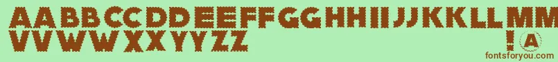 Zagzaggoosepimples-Schriftart – Braune Schriften auf grünem Hintergrund