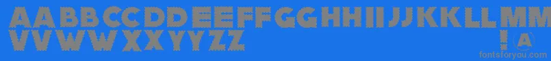 Zagzaggoosepimples-Schriftart – Graue Schriften auf blauem Hintergrund