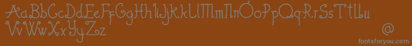 Шрифт Thewambiresdemo – серые шрифты на коричневом фоне