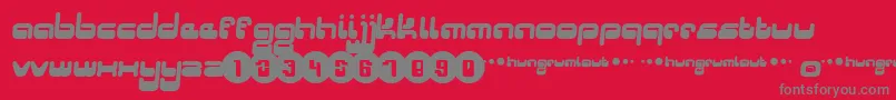 Hungrumlaut-Schriftart – Graue Schriften auf rotem Hintergrund
