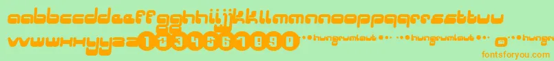 Hungrumlaut-Schriftart – Orangefarbene Schriften auf grünem Hintergrund