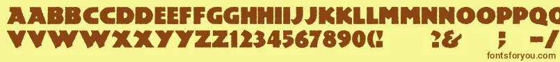 フォントMesozoic – 茶色の文字が黄色の背景にあります。