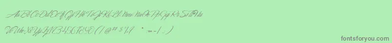 DancingInTheMoonlight Font – Gray Fonts on Green Background