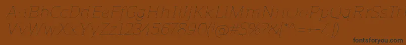 ReganslabUltralightitalic-fontti – mustat fontit ruskealla taustalla