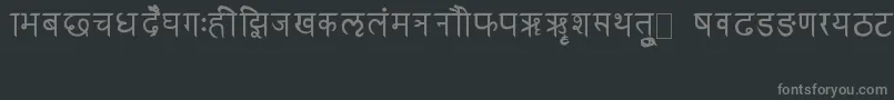 Czcionka RkSanskrit – szare czcionki na czarnym tle