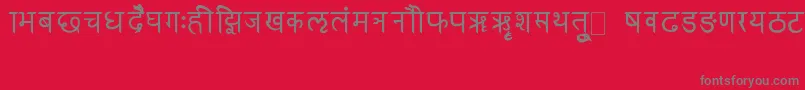 フォントRkSanskrit – 赤い背景に灰色の文字