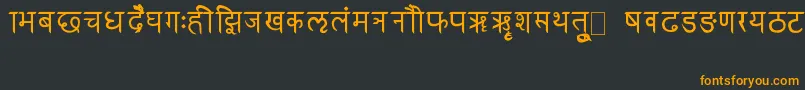 フォントRkSanskrit – 黒い背景にオレンジの文字