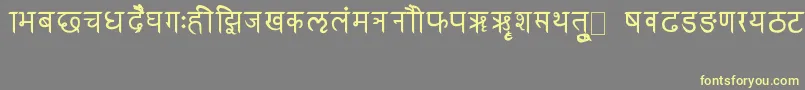 フォントRkSanskrit – 黄色のフォント、灰色の背景