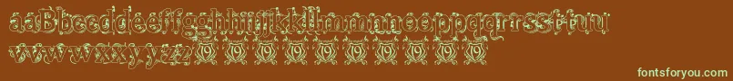 フォントBeauregardHollow – 緑色の文字が茶色の背景にあります。
