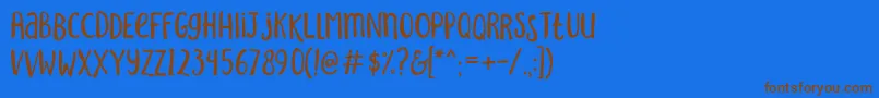 SakraRegular-Schriftart – Braune Schriften auf blauem Hintergrund