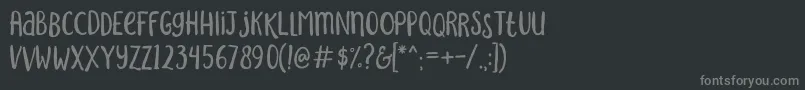 フォントSakraRegular – 黒い背景に灰色の文字