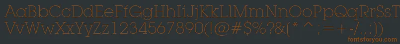 LubalinGraphExtraLightBt-fontti – ruskeat fontit mustalla taustalla