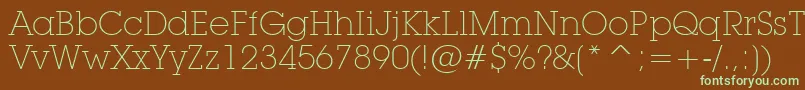 フォントLubalinGraphExtraLightBt – 緑色の文字が茶色の背景にあります。