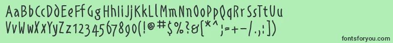 Alphabetismhand Font – Black Fonts on Green Background