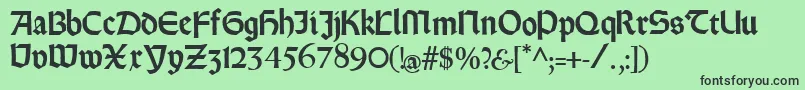 Rundgotischrauh Font – Black Fonts on Green Background