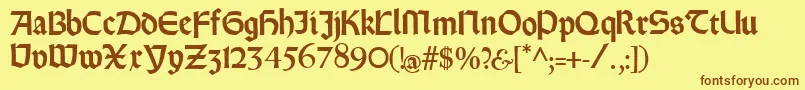 Rundgotischrauh Font – Brown Fonts on Yellow Background