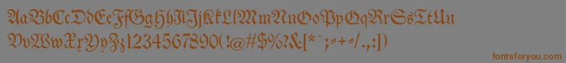 フォントNeuetheuerdankfrakturunz1a – 茶色の文字が灰色の背景にあります。