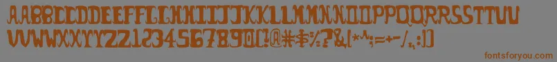 フォントPossum – 茶色の文字が灰色の背景にあります。