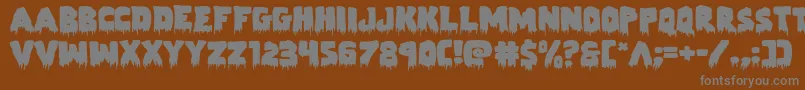 Zombiecontrolexpand-Schriftart – Graue Schriften auf braunem Hintergrund