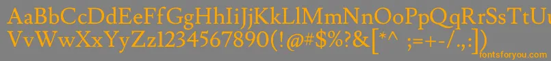 フォントLusitanaRegular – オレンジの文字は灰色の背景にあります。