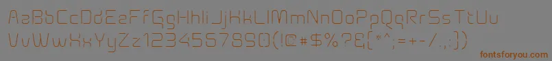 Шрифт Aunchanted Xspace Thin – коричневые шрифты на сером фоне